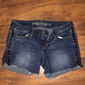 Denim shorts with leather braid